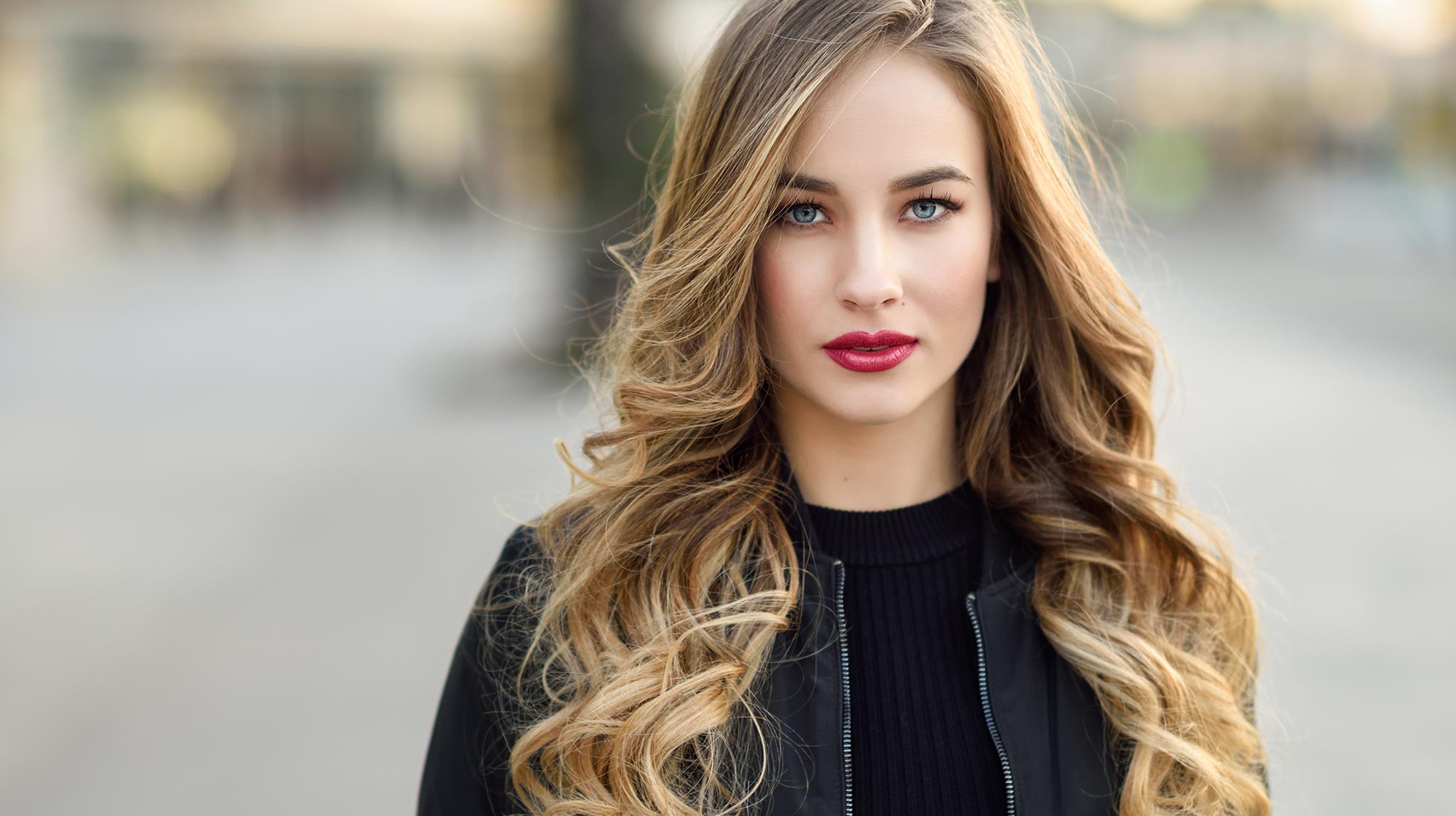 Expert hair stylist performing the best balayage services in Surrey