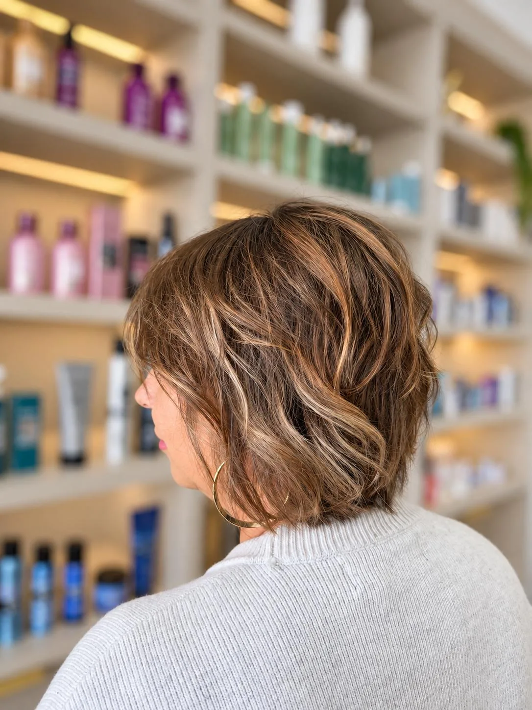 Short layered bob with caramel highlights