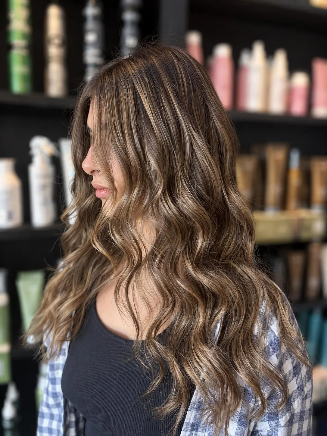 Long brunette waves with blonde highlights