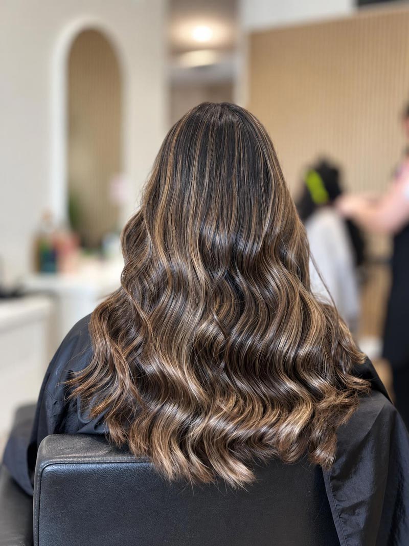 Long cool brunette hair with softly blended highlights